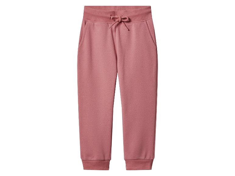 Pantalon de jogging rose pour femme avec cordon de serrage et poches.