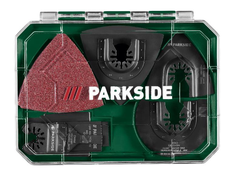 Kit d'accessoires pour outil multifonction avec lames de scie et papier de verre dans un étui vert.