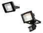 Deux projecteurs LED noirs, dont un avec détecteur de mouvement, sur fond blanc.