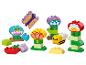 Jouets de construction colorés pour enfants, comprenant des fleurs, un papillon et une abeille.