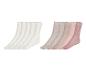 Un ensemble de chaussettes blanches et roses.