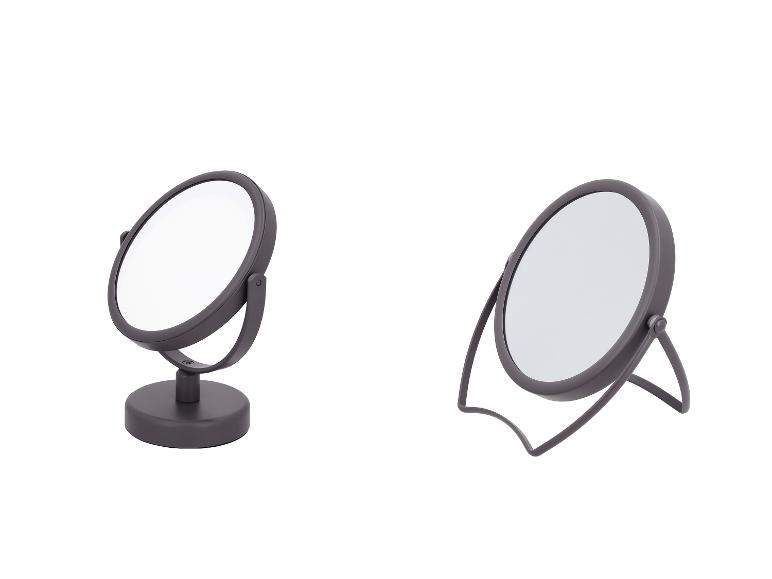 Deux miroirs de maquillage de table gris avec des bases différentes.