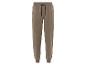 Pantalon de survêtement beige avec cordon de serrage.