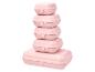 Pile de cinq boîtes à lunch en plastique rose de tailles variées