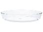 Plat à four Pyrex rond en verre transparent.