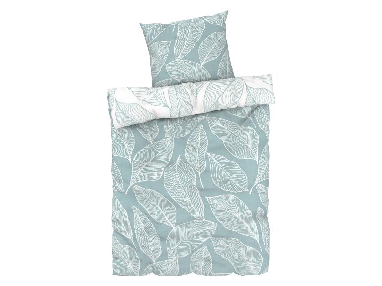 Une parure de lit avec un motif de feuilles.
