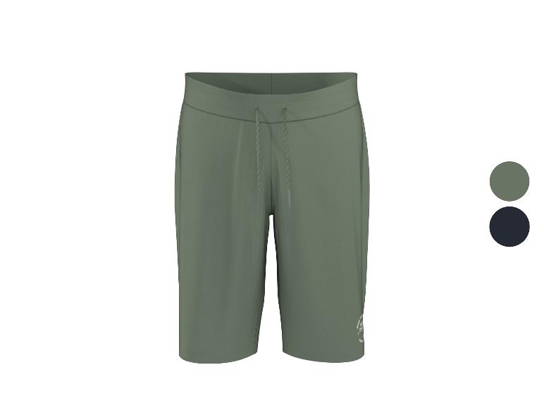 Short de sport vert avec cordon de serrage ajustable et petit logo.