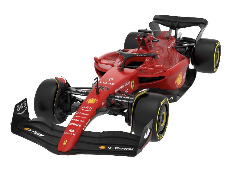 Une voiture de course de Formule 1 Ferrari rouge avec des sponsors comme AWS, Shell et Santander.