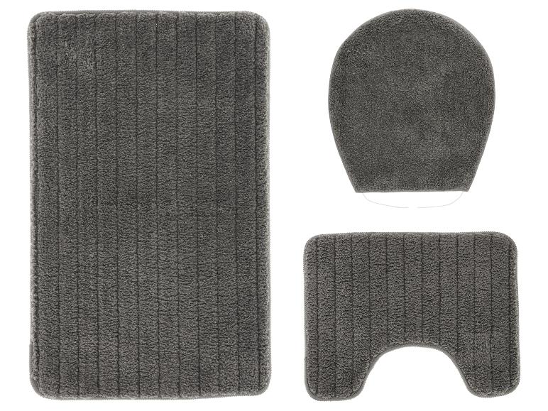 Ensemble de tapis de salle de bain gris foncé avec un tapis rectangulaire, une housse de siège de toilette et un tapis en forme de U.
