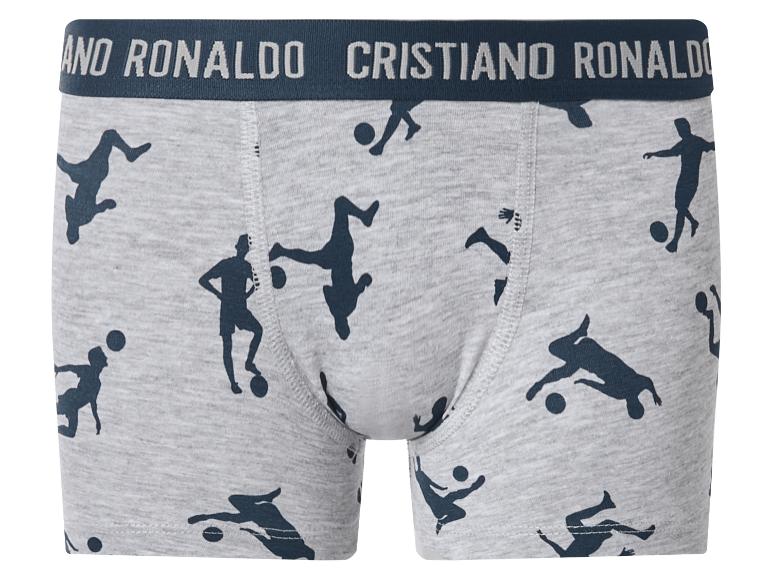 Caleçon gris avec des silhouettes de joueurs de football et une ceinture avec du texte.