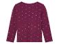 Un t-shirt à manches longues violet à pois blancs pour fille.