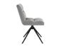 Chaise de salle à manger en velours gris clair avec pieds en métal noir, vue latérale.