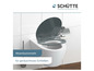 Un abattant de toilette gris avec fermeture douce de Schütte.
