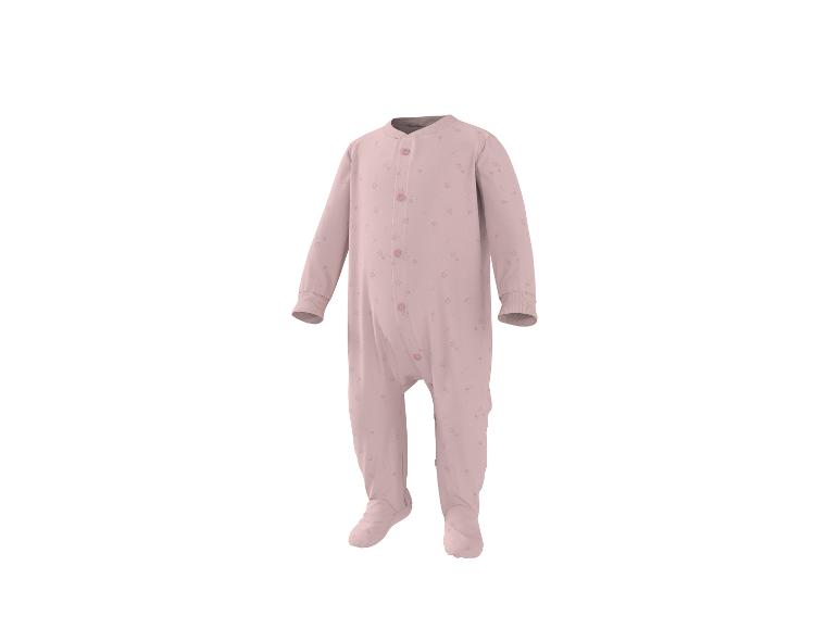 Grenouillère rose pour bébé avec motif étoiles et boutons sur le devant.