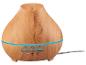 Diffuseur d'huiles essentielles en bois clair avec bande lumineuse bleue et boutons de minuterie