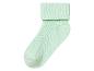 Une chaussette de couleur vert clair avec une texture côtelée.