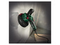 Une ponceuse Parkside verte pour poncer les murs.