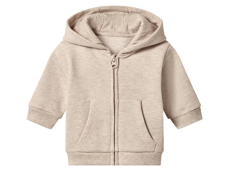 Sweat à capuche beige pour bébé avec fermeture éclair et poches.