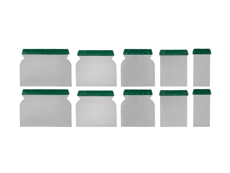 Ensemble de spatules métalliques avec poignées vertes.
