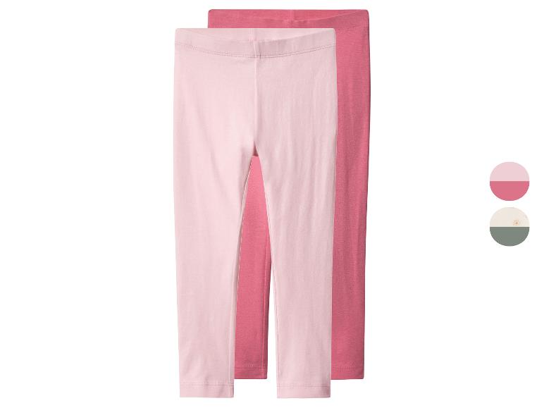 Deux paires de leggings pour enfants, un rose clair et un rose foncé, avec des échantillons de couleur