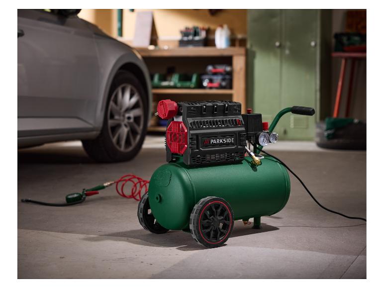 Compresseur d'air PARKSIDE vert avec roues, tuyau et manomètre, dans un garage.