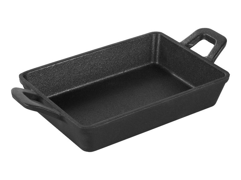 Plat rectangulaire en fonte noire avec poignées, idéal pour servir ou cuisiner.