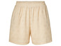Short beige avec un motif floral détaillé.