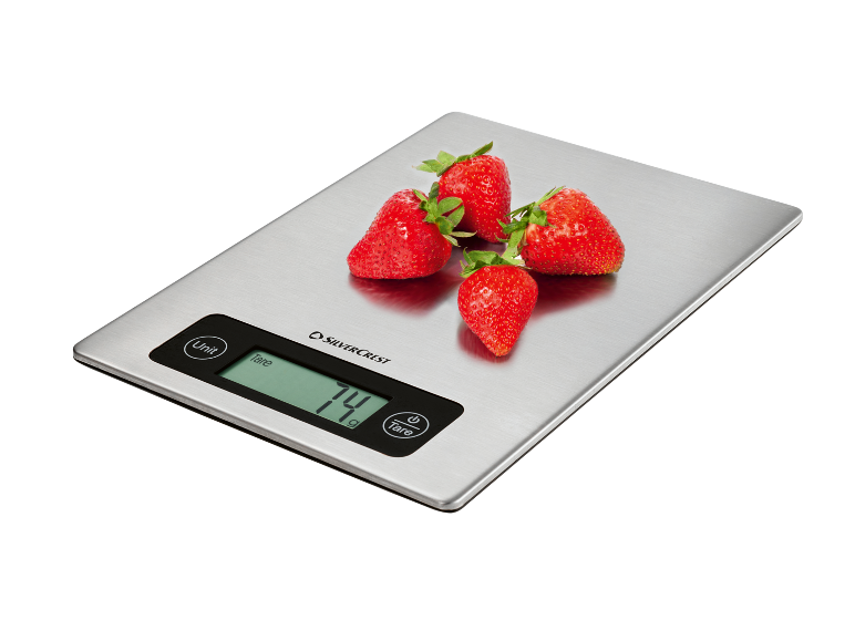 Balance de cuisine numérique avec des fraises, affichant '74 g'.