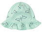 Un chapeau de bébé vert menthe avec un motif de dauphins.