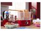 Un chauffe-hot-dogs SilverCrest rouge avec des hot-dogs et des petits pains