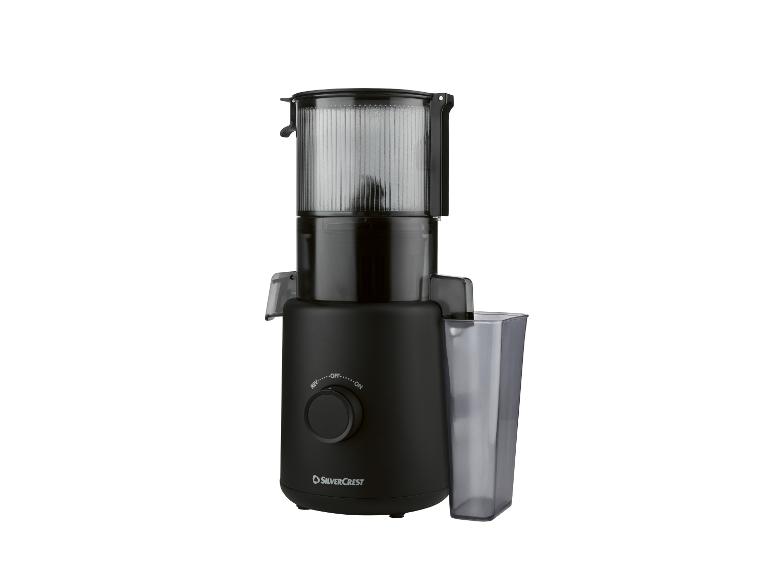 Extracteur de jus électrique noir avec un récipient transparent.