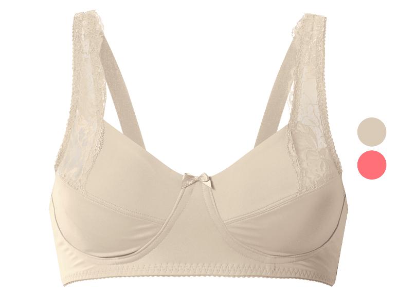 Soutien-gorge beige avec détails en dentelle et un petit nœud au centre.