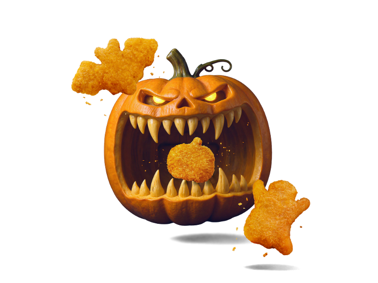 Nuggets de poulet d'Halloween en formes effrayantes avec une citrouille.