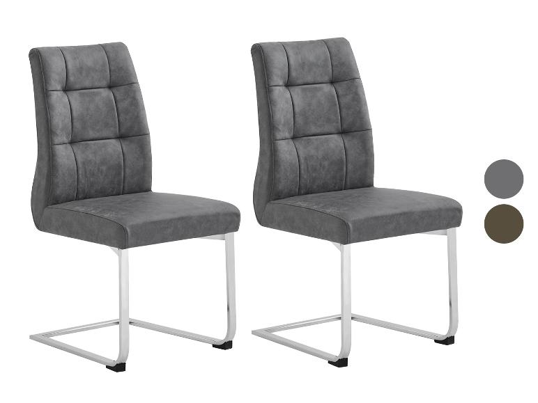 Deux chaises design gris foncé, pieds métalliques chromés.