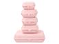 Pile de cinq boîtes à lunch en plastique rose de différentes tailles.