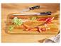 Couteau Silvercrest, aiguiseur et légumes sur planche à découper.