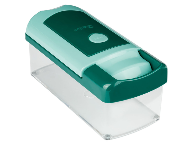 Un presse-agrumes Genius vert avec un récipient transparent.