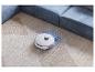 Un aspirateur robot Deebot blanc sur un tapis.