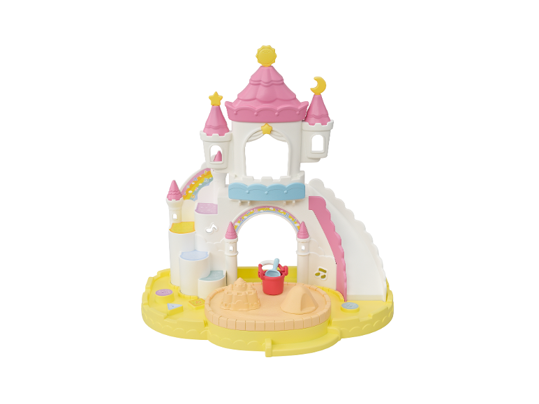 Château de sable jouet rose et blanc avec toboggan, seau et pelle.
