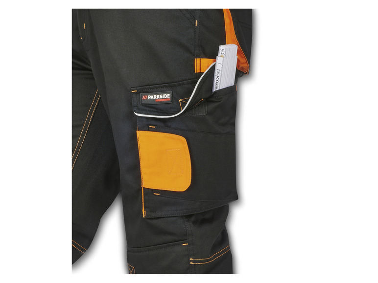 Pantalon de travail noir avec des détails orange et le logo Parkside Performance.