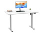 Un bureau blanc avec un moniteur, un clavier et une station de charge.