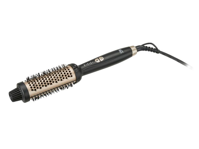 Brosse soufflante noire et dorée avec contrôle de la température et cordon.