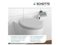 Un abattant de toilette blanc et un porte-papier toilette de Schütte.