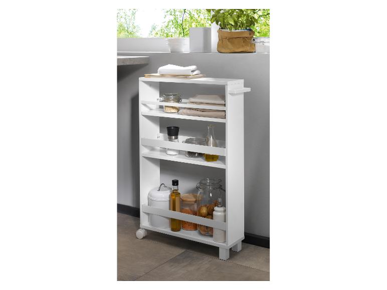 Chariot de cuisine blanc avec divers articles.