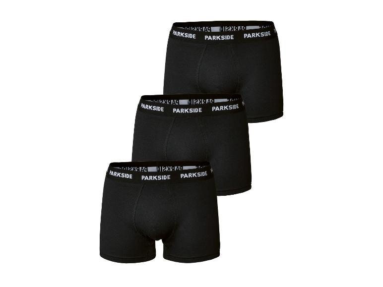 Trois paires de boxers noirs pour hommes avec logo blanc sur la ceinture