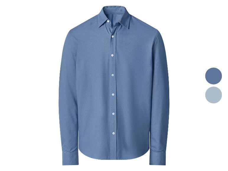 Chemise homme à manches longues bleue avec boutons blancs.