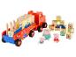 Un camion rouge Peppa Pig avec des blocs et des figurines.