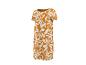 Robe longue femme à manches courtes avec imprimé feuilles blanches sur fond orange.