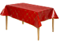 Nappe de Noël rouge avec motifs festifs dorés sur une table en bois.