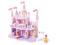 Château de poupée rose avec figurines et balançoire.